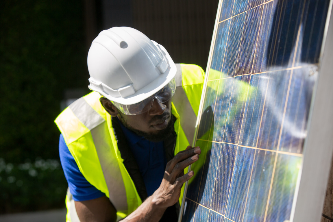 Maintenance Engineer Inspecting the Solar Panel 