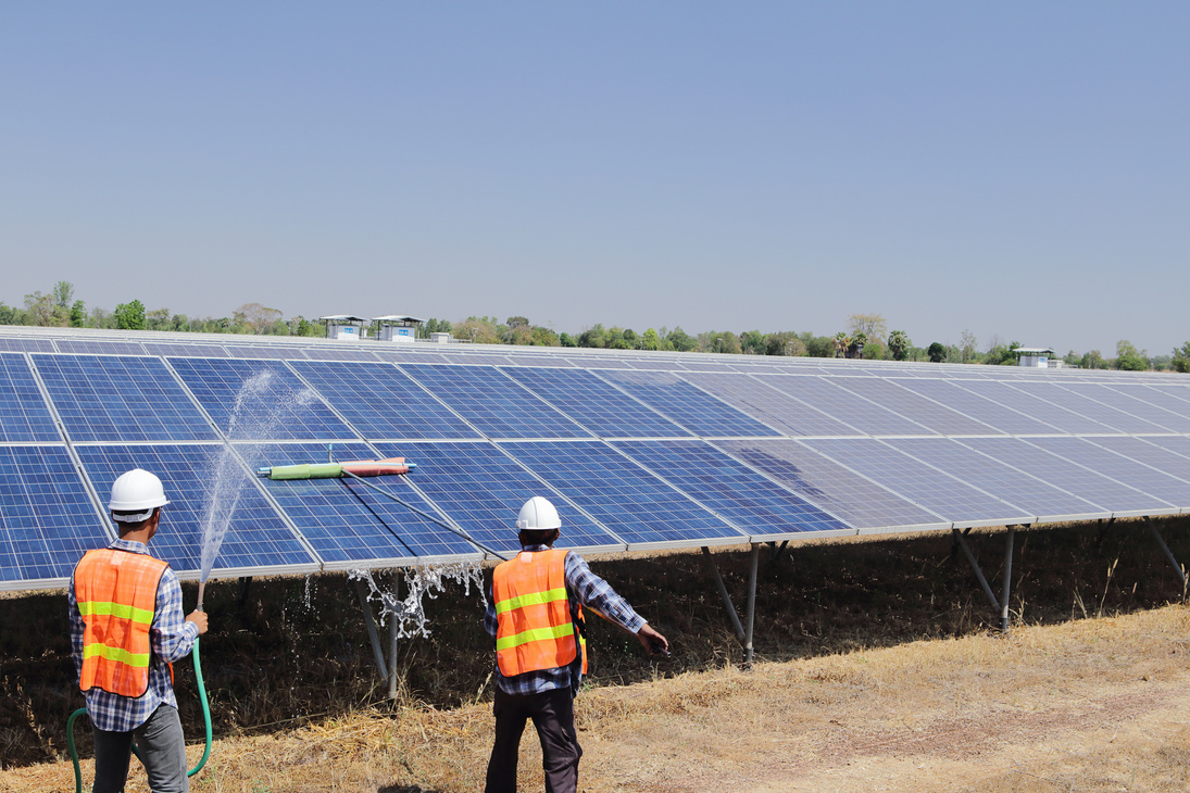 Technicians Cleaning Solar Cells