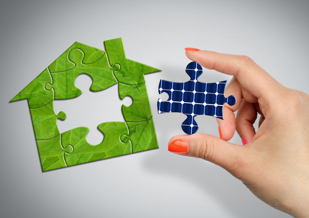 solar energy concept, puzzle house with solar battery window